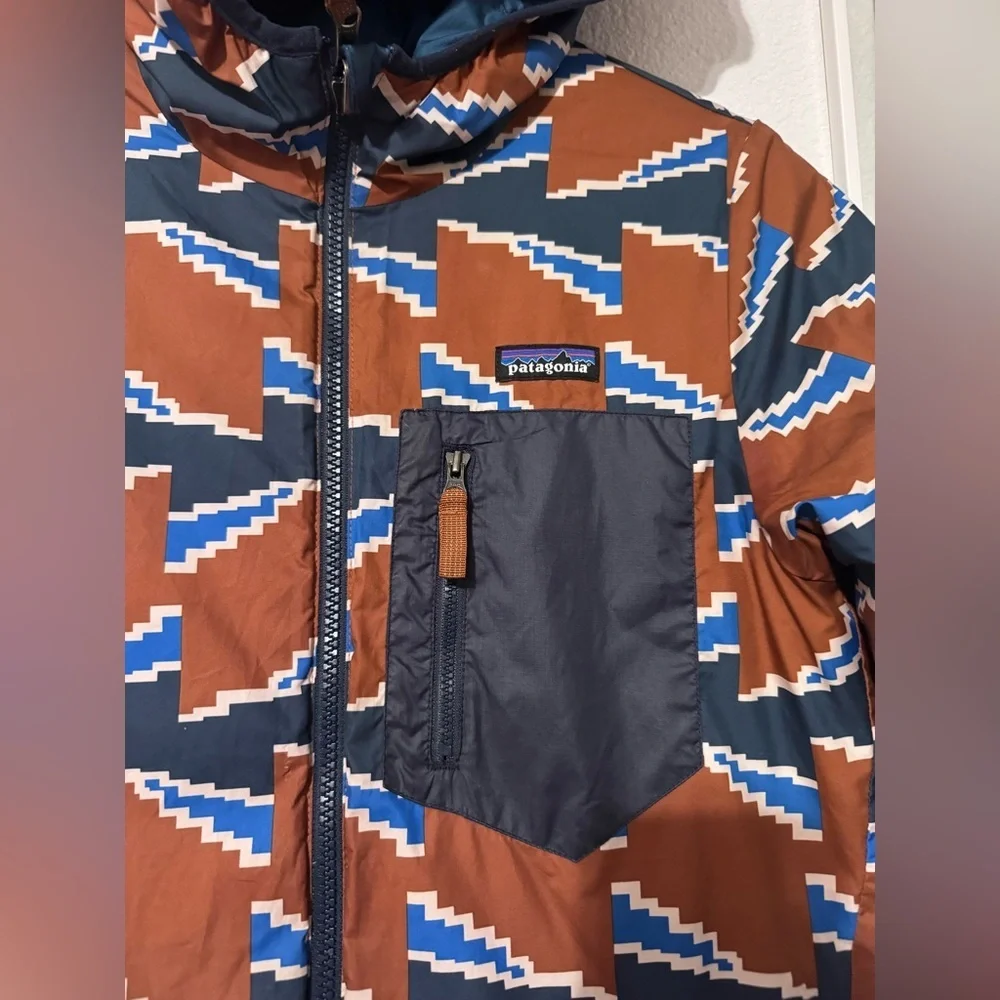 Patagonia Blue and Brown Puffer Jacket with Geometric Design
